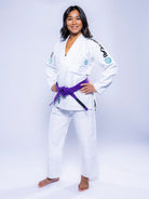 A woman wearing the Womens SEKAI 3.0 BJJ Gi in White Teal.
